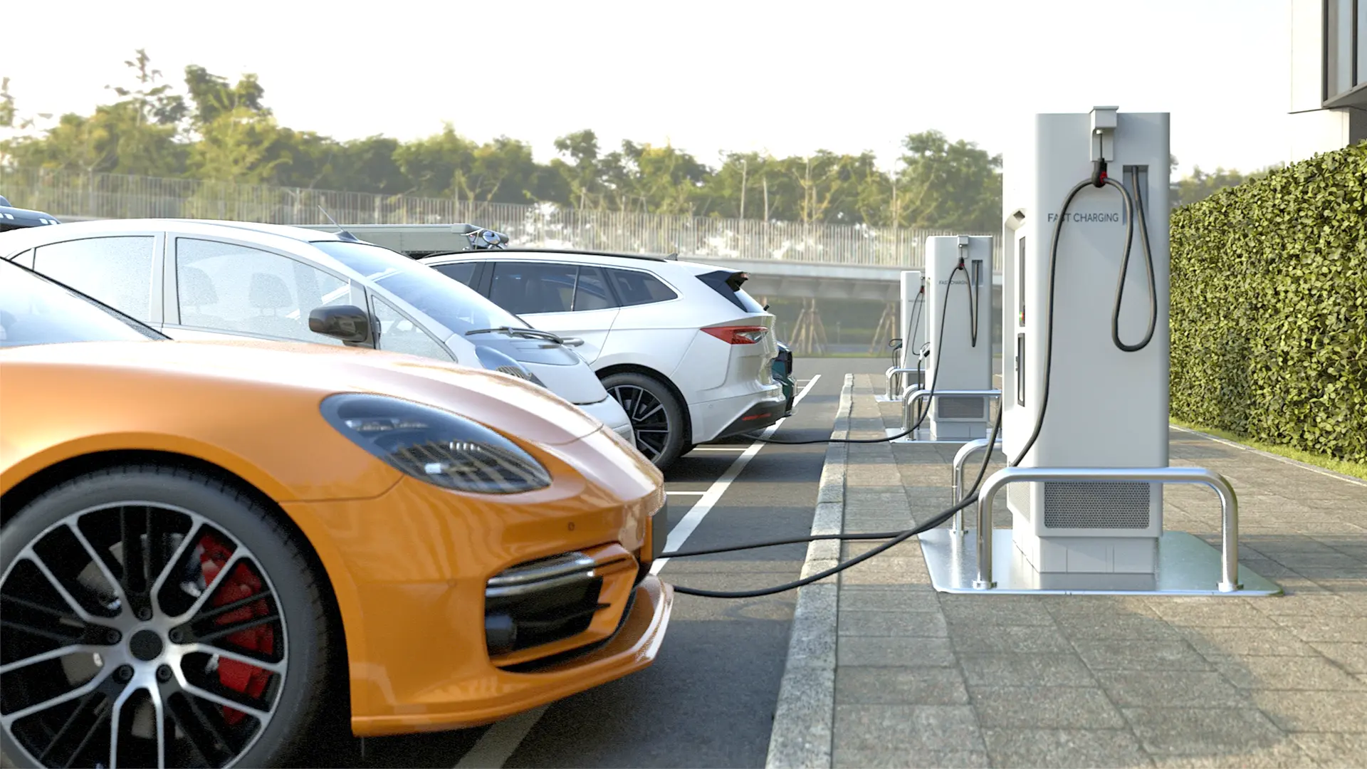 Electric car is charging at a charging station with a building in the background